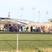 Soldiers raise flag at youth baseball game