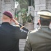 Paratrooper salutes during ceremony