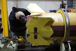 A technician repairs an Army Tactical Missile System at Letterkenny Munitions Center.