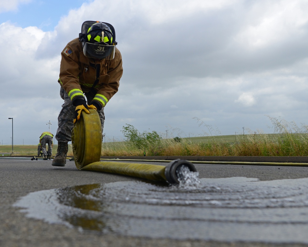 9th CES fire fighters test, certify firehoses