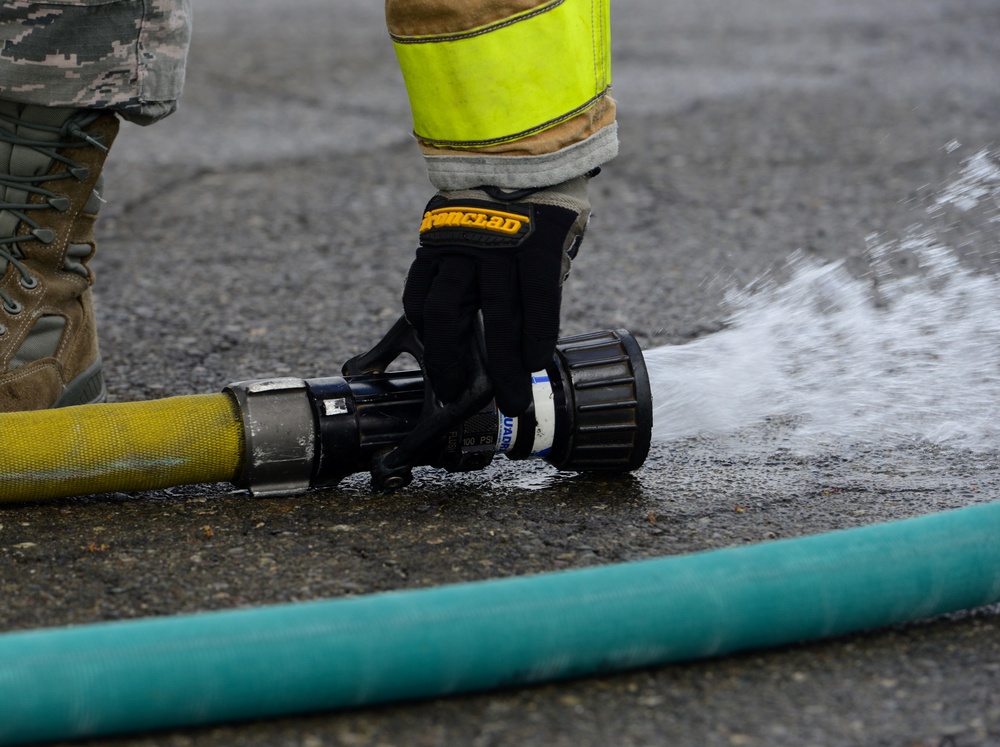9th CES fire fighters test, certify firehoses