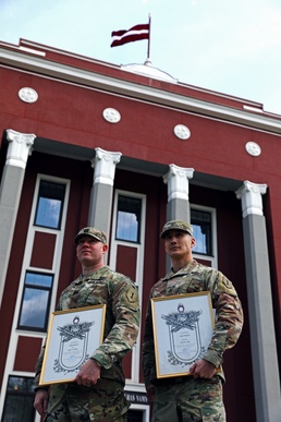 Latvian Minister of Defence honors U.S. Soldiers during the centennial celebration of the Latvian War for Independence and their Armed Forces