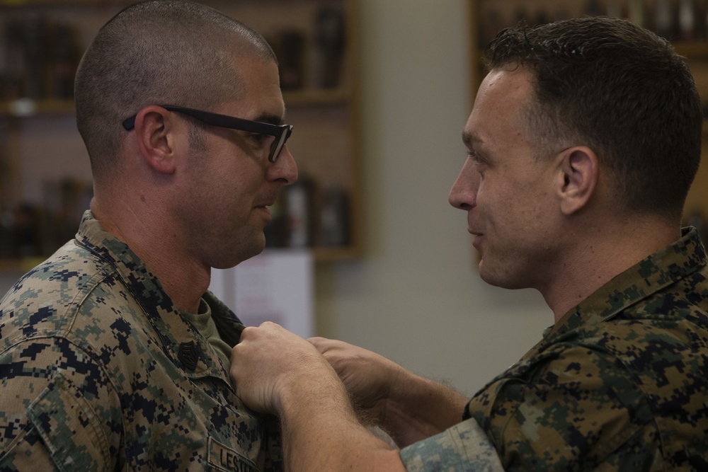 Gunnery Sgt. Michael Lesterick receives the Master EOD Breast Insignia