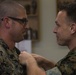 Gunnery Sgt. Michael Lesterick receives the Master EOD Breast Insignia