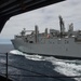 The dry cargo and ammunitions ship USNS Charles Drew (T-AKE 10) conduct a replenishment-at-sea alongside the aircraft carrier USS John C. Stennis (CVN 74)