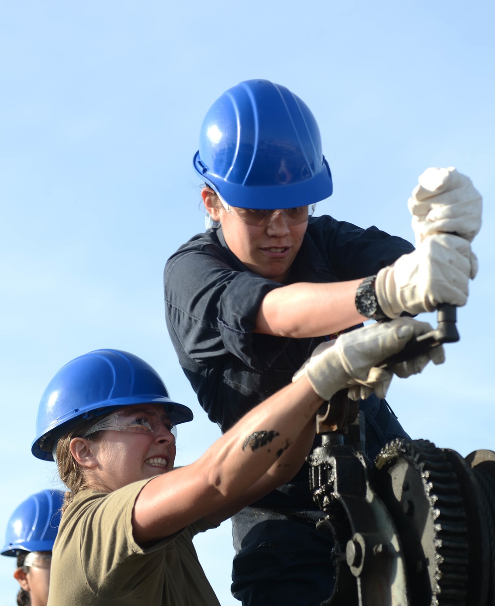 Sailors Remove Catapault Cylinder