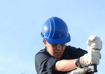 Sailors Remove Catapault Cylinder