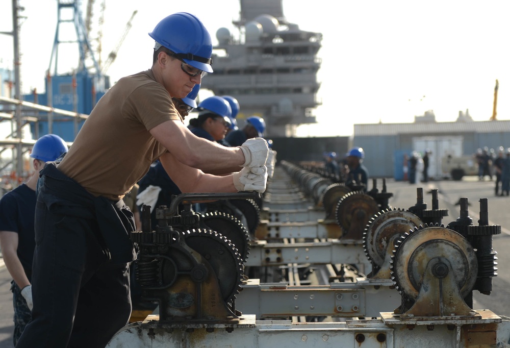 Sailors Remove Catapault Cylinder