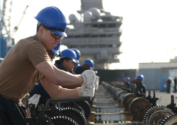 Sailors Remove Catapault Cylinder