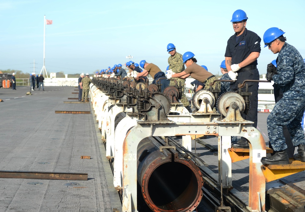 Sailors Remove Catapault Cylinder