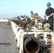 Sailors Remove Catapault Cylinder