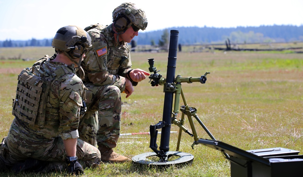 Special Forces soldiers shoot mortars during drill weekend