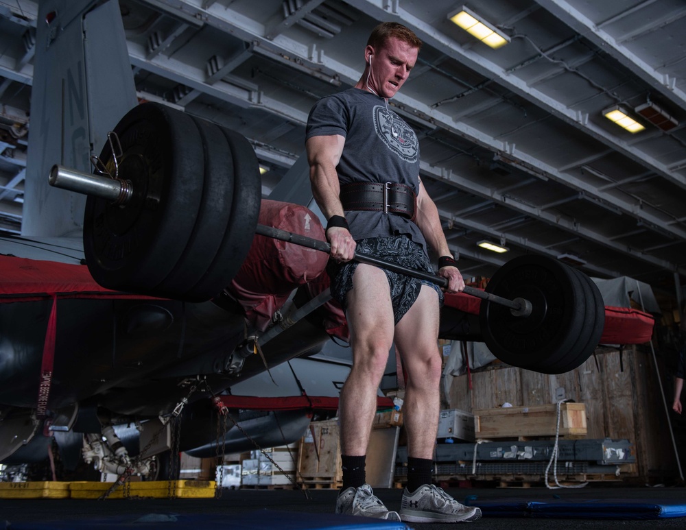 U.S. Sailor exercises in the hangar bay