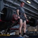 U.S. Sailor exercises in the hangar bay