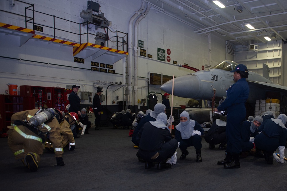 U.S. Sailors participate in a simulated general quarter drill