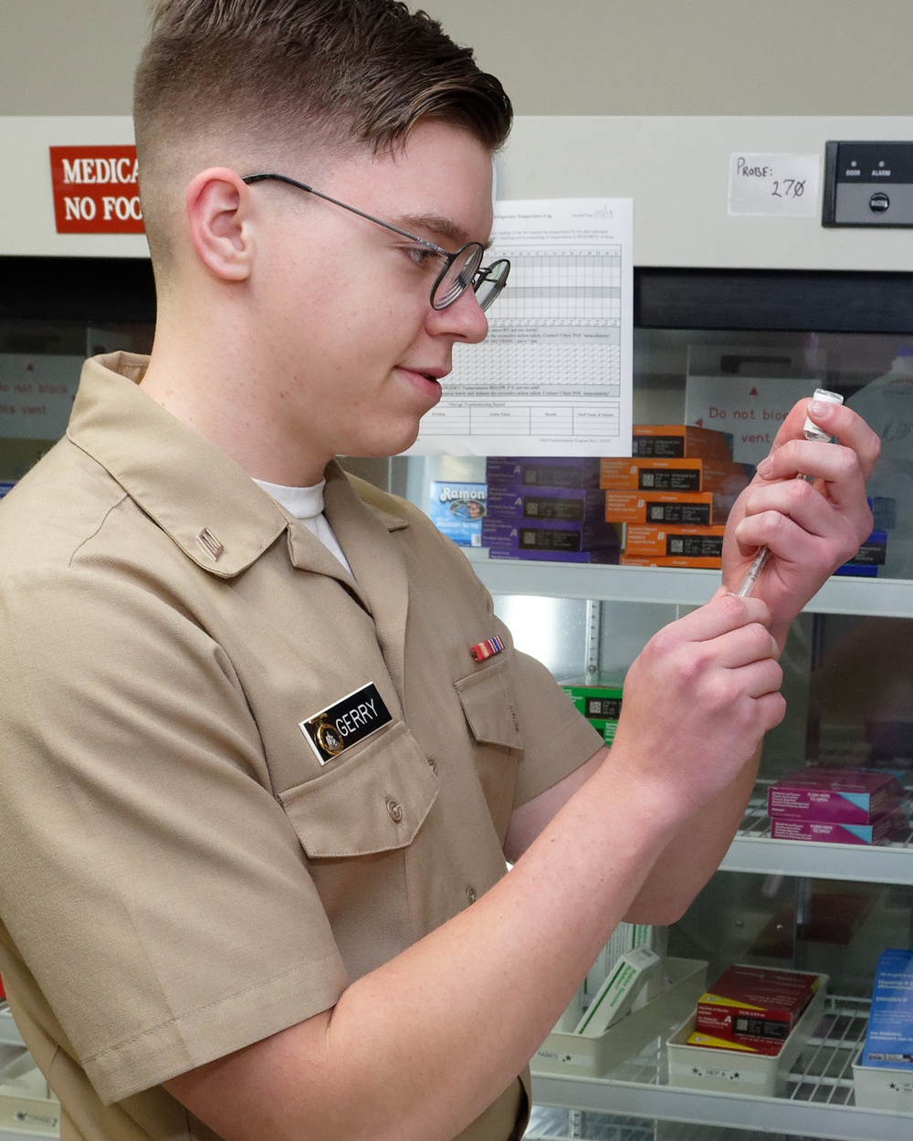 Corpsman prepares a vaccination