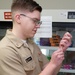 Corpsman prepares a vaccination