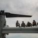 U.S. Marines conduct maintenance on an MV-22 Osprey