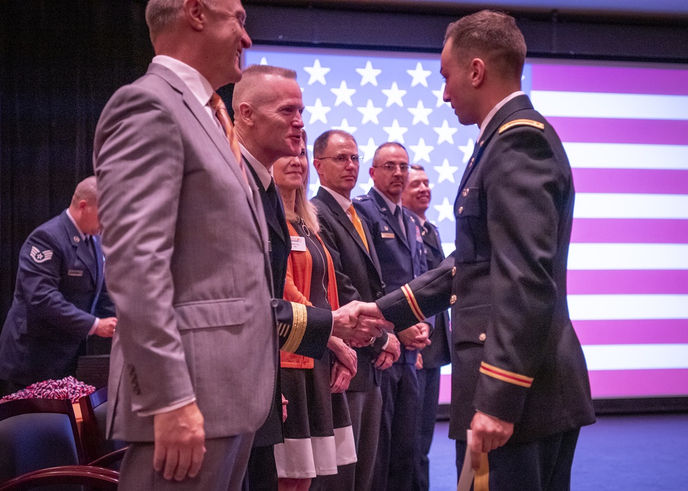 Lt. Gen. Thomas James Jr. shakes cadet's hand