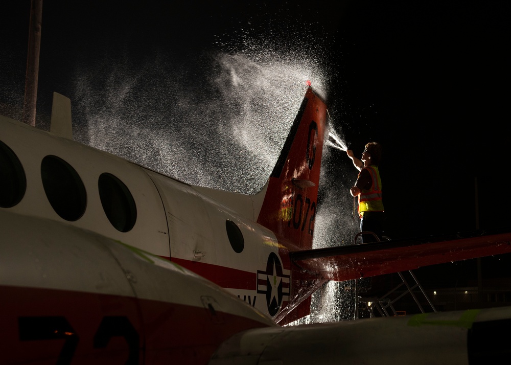 Aircraft Washer cleans a T-44C Pegasus aboard NAS Corpus Christi