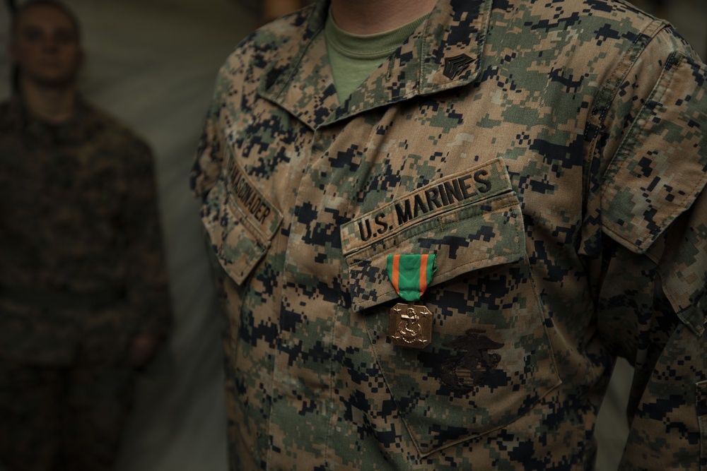 III Marine Expeditionary Force commanding general awards Marines with Navy and Marine Corps Achievement Medals during the Marine Expeditionary Force Exercise