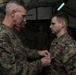 III Marine Expeditionary Force commanding general awards Marines with Navy and Marine Corps Achievement Medals during the Marine Expeditionary Force Exercise
