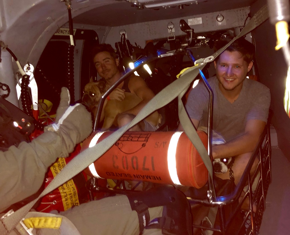 Coast Guard rescues 2 men, 3dogs near Poplarville, Mississippi