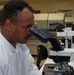 Hospital Corpsman Examines Specimens at Naval Hospital Camp Pendleton's Lab