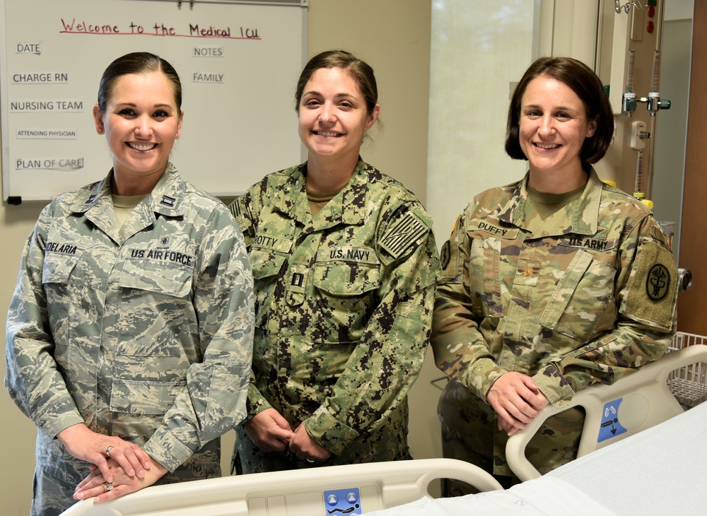 Nurses from three branches of Service care for patients at Walter Reed Bethesda