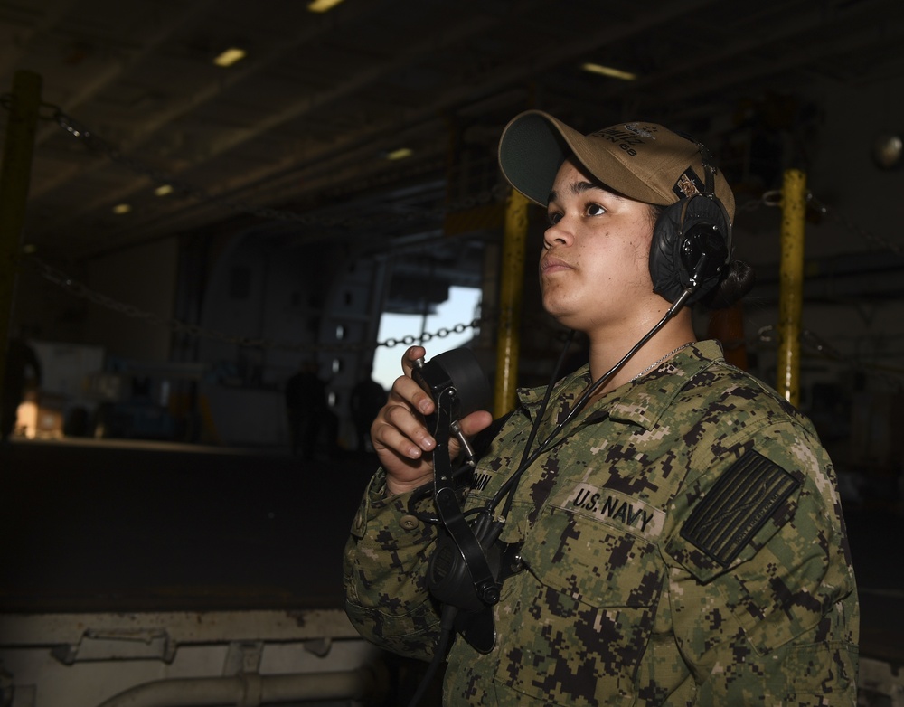 Nimitz Sailors Move Supplies