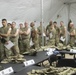 U.S. Army Reserve Soldiers line up to receive vaccination shots during Vibrant Response 2019