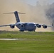 C-17 Takes Off from Dirt Airfield