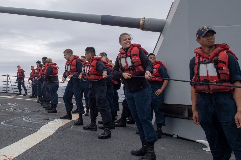 Sailors aboard the Arleigh Burke-class guided-missile destroyer USS Momsen (DDG 92) conduct line handling during a replenishment-at-sea with the fleet replenishment oiler USNS Walter S. Diehl (T-AO 193).