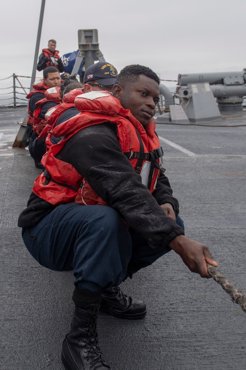 Sailors aboard the Arleigh Burke-class guided-missile destroyer USS Momsen (DDG 92) conduct line handling during replenishment-at-sea with the fleet replenishment oiler USNS Walter S. Diehl (T-AO 193).