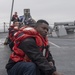 Sailors aboard the Arleigh Burke-class guided-missile destroyer USS Momsen (DDG 92) conduct line handling during replenishment-at-sea with the fleet replenishment oiler USNS Walter S. Diehl (T-AO 193).