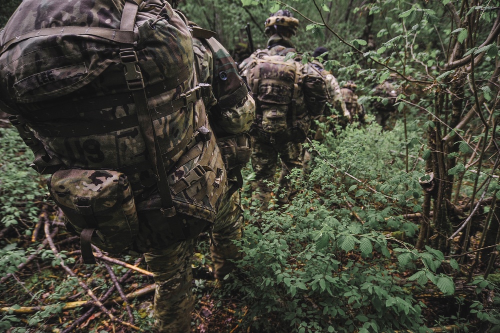 Paratroopers move through tough terrain