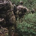 Paratroopers move through tough terrain