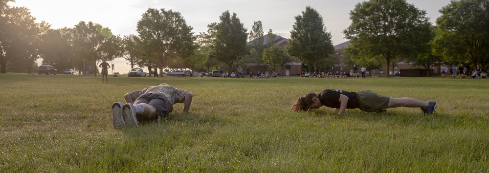 Coach Dan Droski and Capt.Cannon conduct push up during the Marine Corps Recruiting Command Coaches Workshop