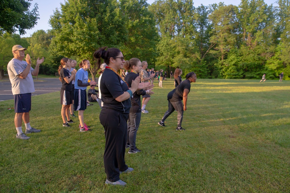 Coaches and Marines participate in a workout session during the Marine Corps Coaches workshop