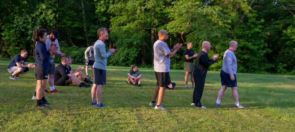 Coaches and Marines participate in a workout session during the Marine Corps Coaches workshop