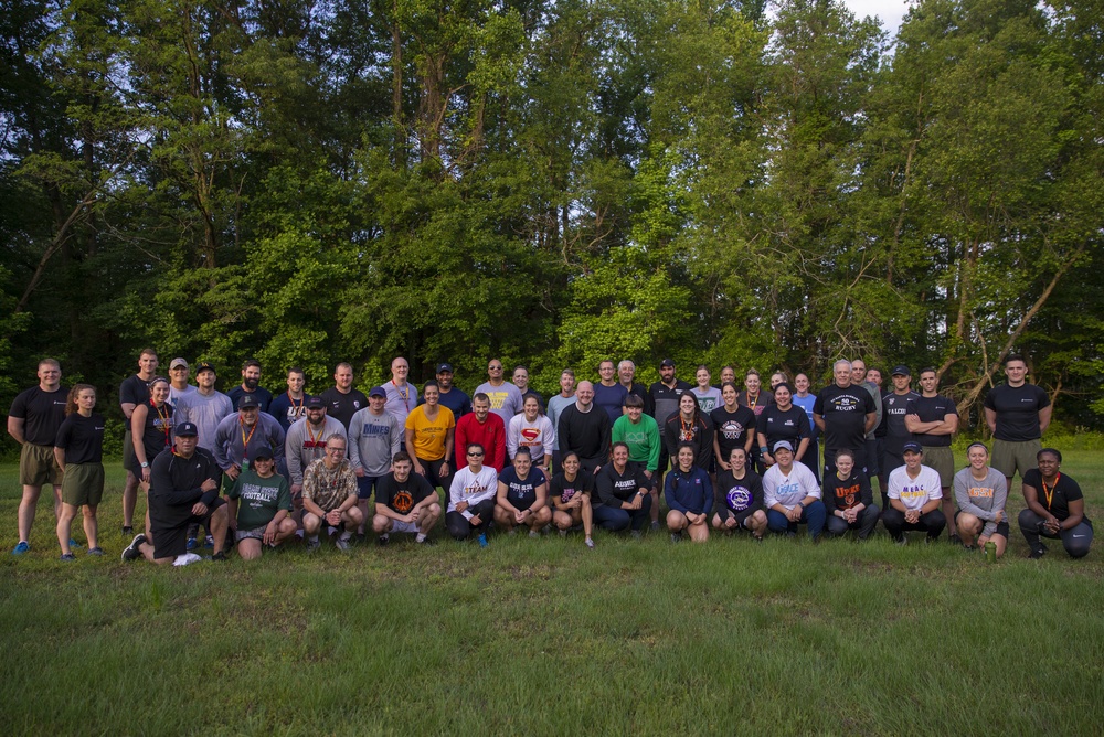 Marines and Coaches pose for a group photo during the Marine Corps Recruiting Command Coaches Workshop