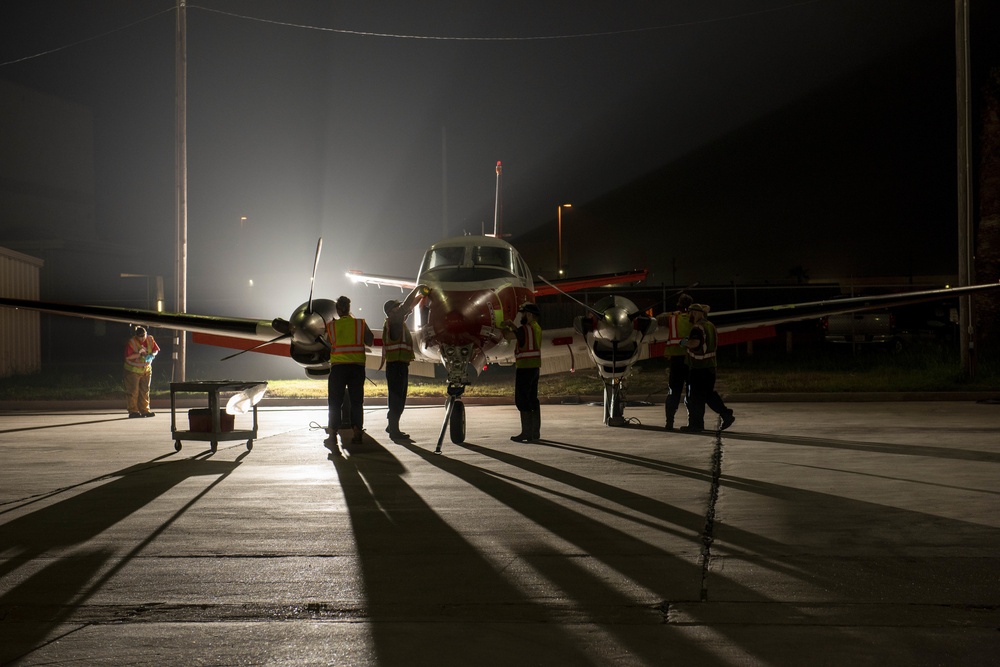 Aircraft Washers clean a T-44C Pegasus