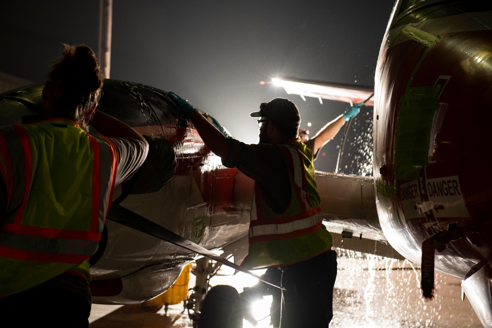 Aircraft Washers clean a T-44C Pegasus