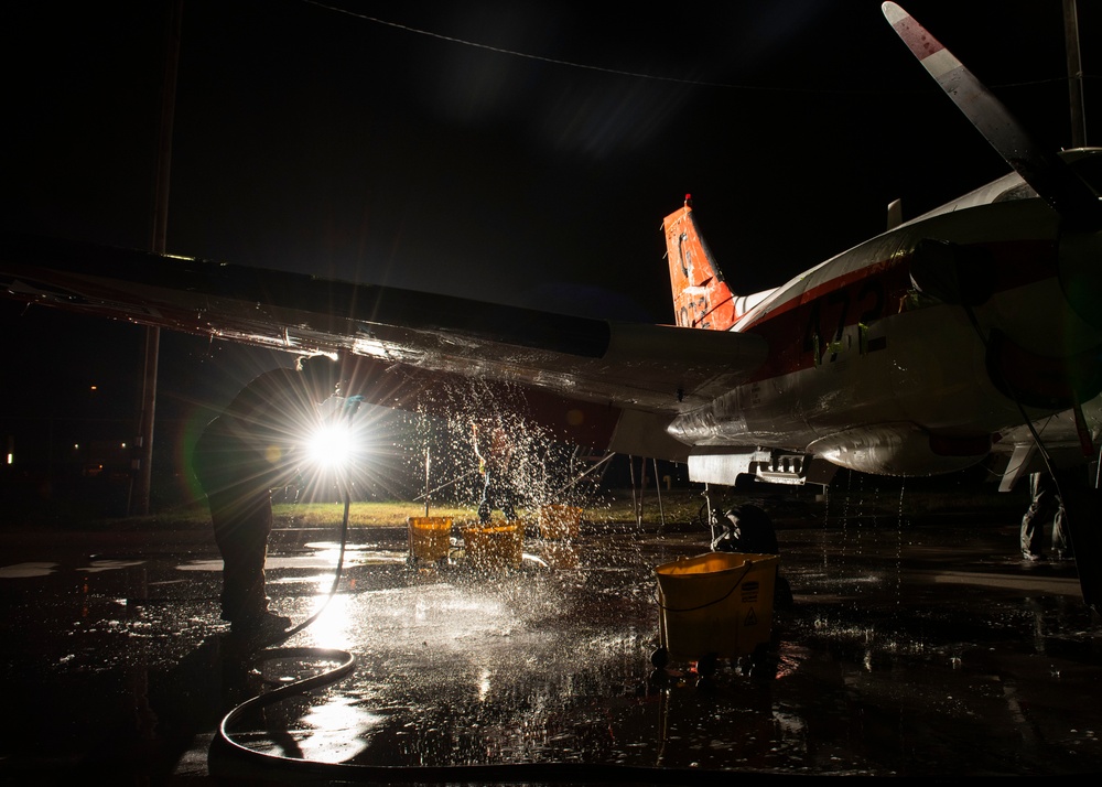 Aircraft Washers clean a T-44C Pegasus