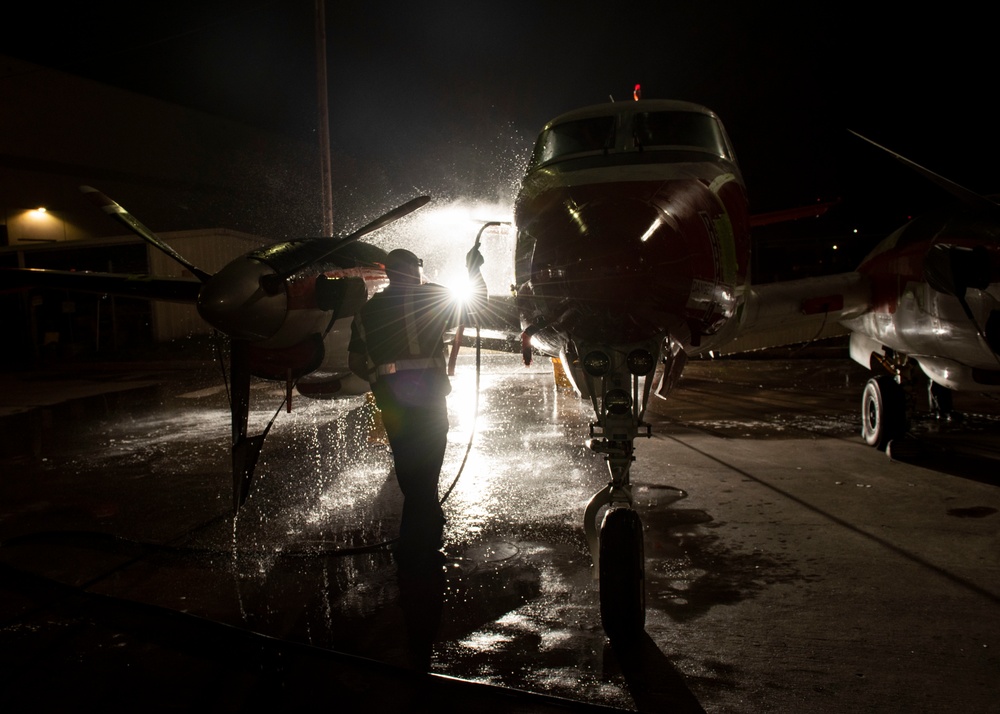 Aircraft Washers clean a T-44C Pegasus