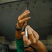 Maintenance in the hangar bay of the Nimitz-class aircraft carrier USS Abraham Lincoln (CVN 72).