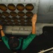 Maintenance in the hangar bay of the Nimitz-class aircraft carrier USS Abraham Lincoln (CVN 72).