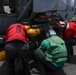 Abraham Lincoln Sailors load ordnance