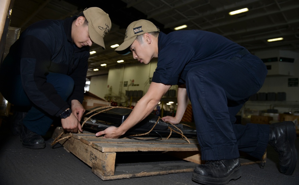 Nimitz Sailors Secure Trash