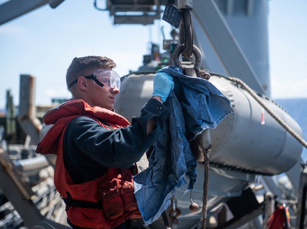 Sailors aboard USS Harpers Ferry Conduct Maintenance